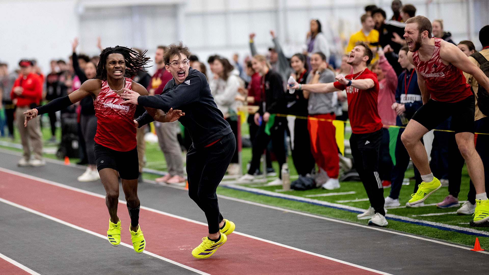 Antonio Weaver celebrates his long jump title | Photo by John Coffman